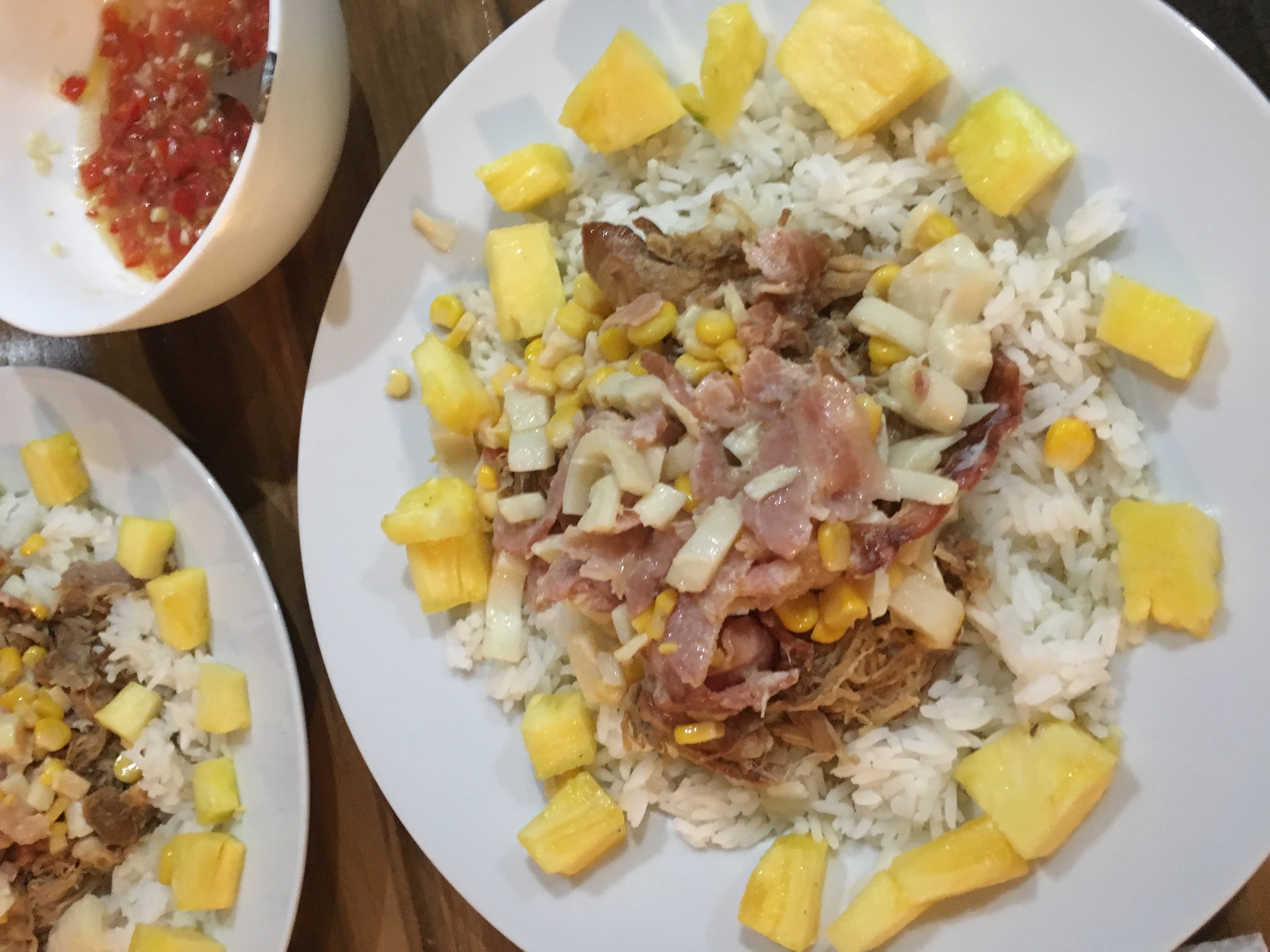 Several kinds of slow-cooked pork with pineapple and heart of palm